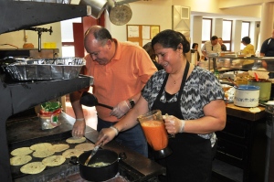 ST. LOUIS – Patricia Hernandez and Santiago Solorio, the volunteers at the Our Lady of Guadalupe Roman Catholic, have brought their Mexican heritage into fish fries. Hernandez makes taco fillings while Solorio prepares fresh tacos. (SLU/Ivana Cvetkovic) 